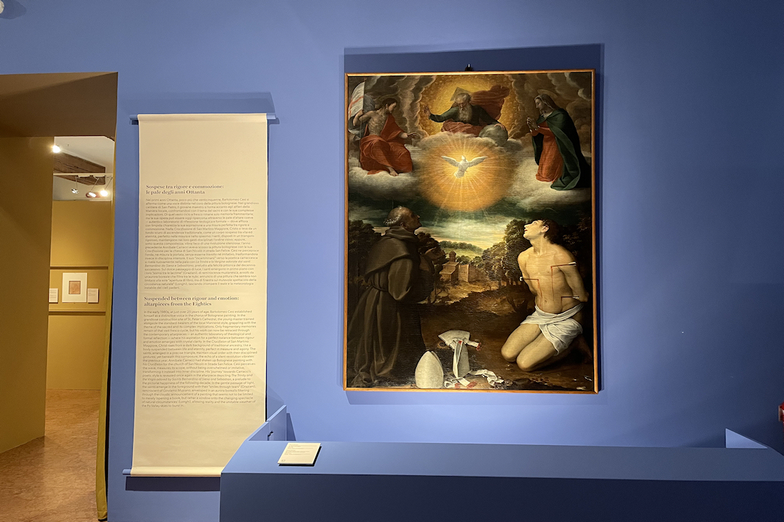 in primo piano Bartolomeo Cesi, La Trinità e la Vergine adorate dai santi Bernardino da Siena e Sebastiano, 1583-1585, Bologna, IRCCS - Azienda Ospedaliero-Universitaria di Bologna - Policlinico di Sant’Orsola